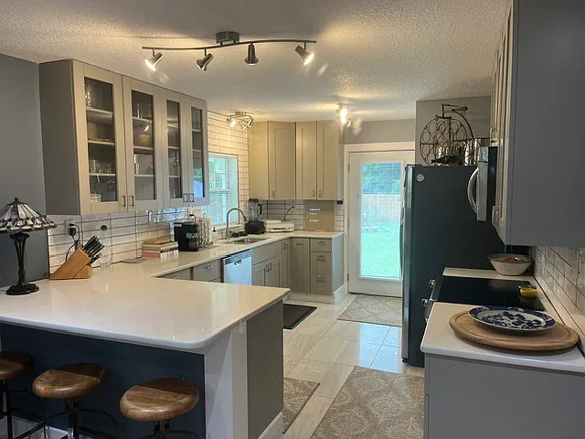 Kitchen with door to backyard.