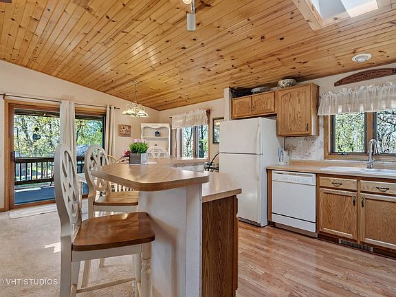 Kitchen with Island seating, you can see everywhere if family is watching a game etc...