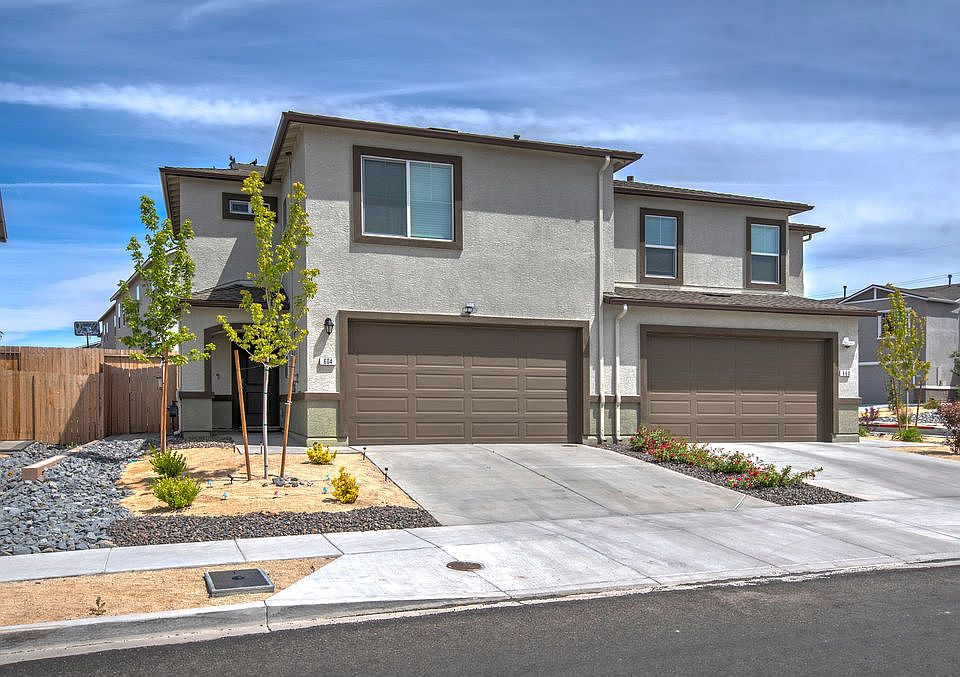 The home is the larger one on the left.