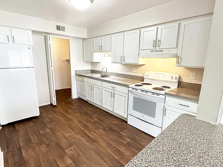 Newly upgraded upscale kitchens and baths with shaker cabinets, granite look countertops.
