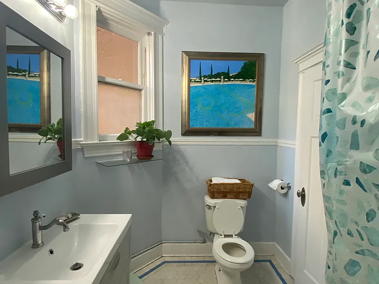 Bathroom has claw-foot bathtub and shower.