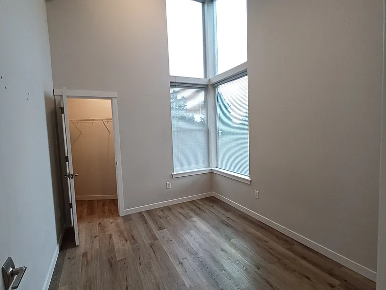 Bedroom 1 similar to this without the 12 foot ceiling shown- updated pictures next week... Actual ceiling 9' without upper windows