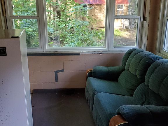 Front enclosed porch with new energy efficient windows.