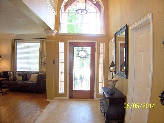 Leaded-Glass Door and Travertine Entry