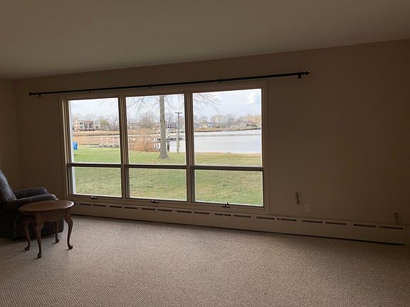 large living room with windows overlooking the bay