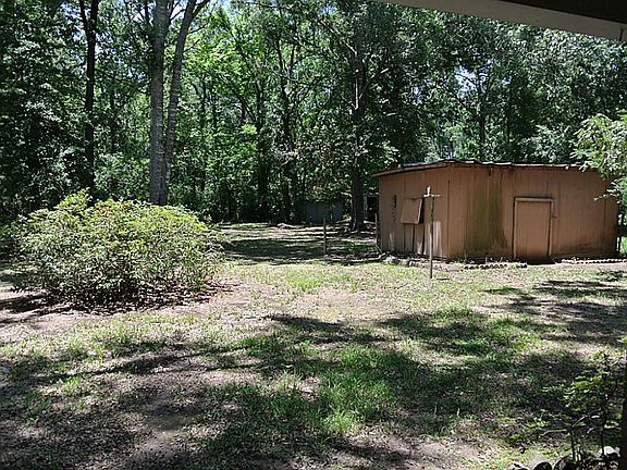 BACK YARD AND WELL HOUSE