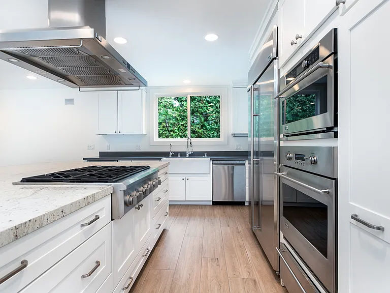 Kitchen, oven, microwave, stove and fridge.