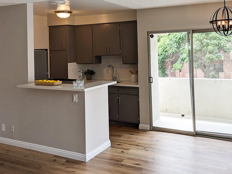 Dining/kitchen area with access to private balcony