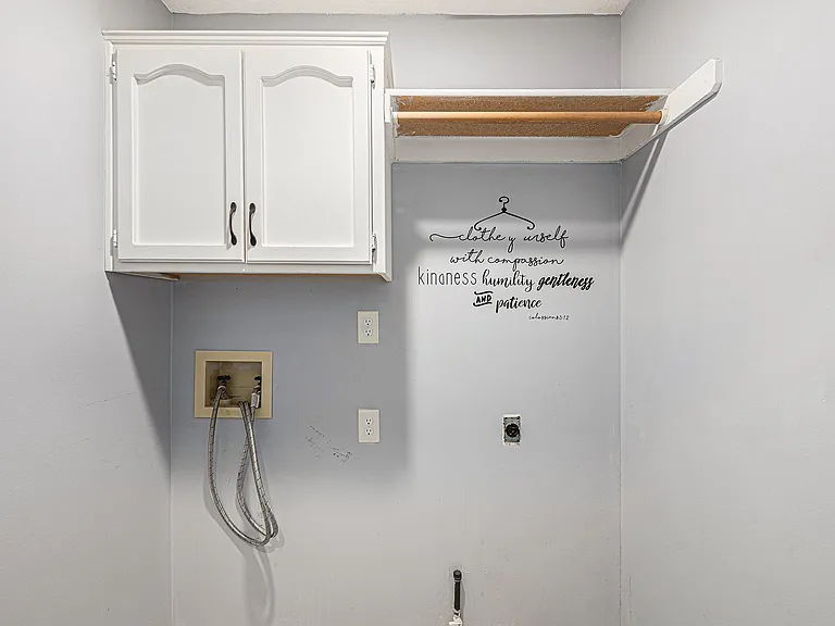Functional and well-equipped, the laundry area features wet and dry machines, providing a convenient and practical space for household tasks.