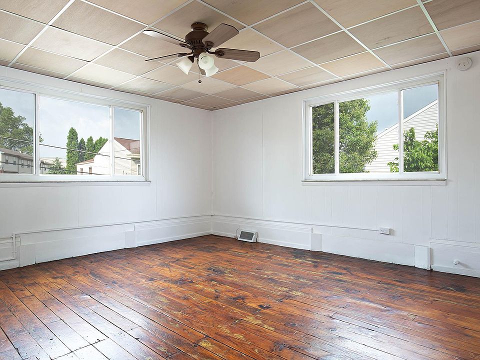 Refinished hardwood floors in the living room.