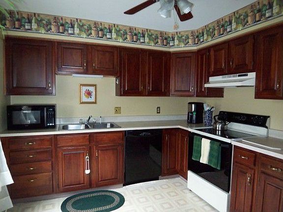 Kitchen with cherry cabinets
