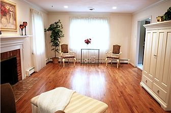 Living room has gleaming hardwood floors