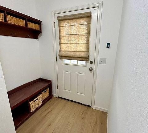 Entry with new plank flooring throughout main floor