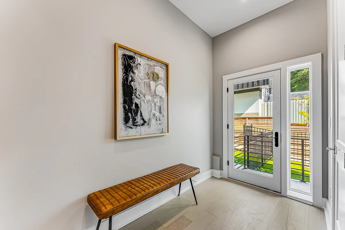 Main entrance. (The available unit is offered unfurnished. This photo depicts the model unit. Finishes and exact floor plan may vary from what is displayed in the images.) - 1099 North Ave NE