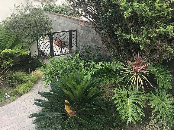 Back entrance from 2 car garage, alley access.