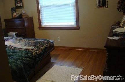 Main Floor Bedroom
						:
						Notice the real hardwood floor!