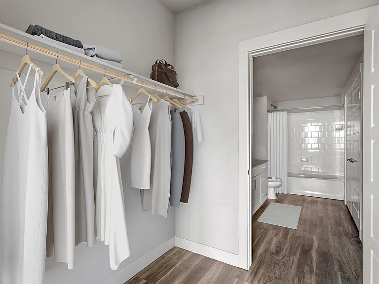 Walk-In Closet with Custom Shelving and Ample Storage Space