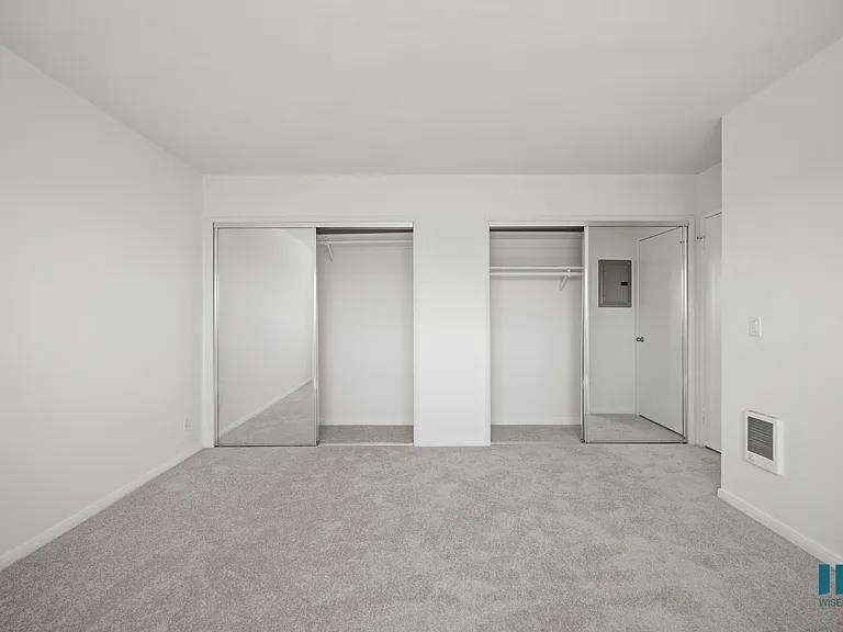 Bedroom with Two Mirrored Closets