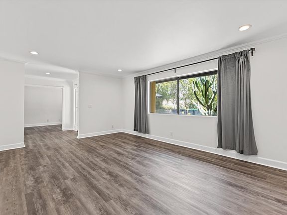 Living room with upgraded floors and new paint.