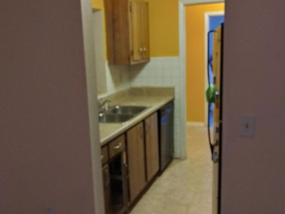 Kitchen through to laundry into the garage