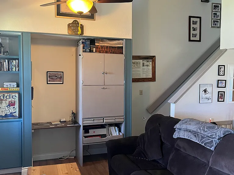 Second workpace! Some pictures may have changed, and the printer is no longer available. Couch reclines and smart tv is on the wall.