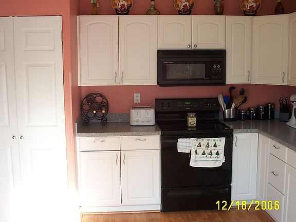 View of the stove/pantry side of the kitchen
