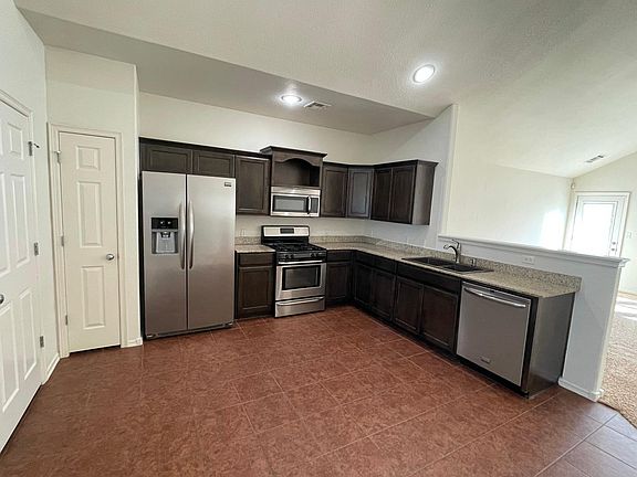 Stainless steel appliances including large side by side fridge included; plenty of storage including a pantry