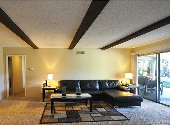 Family Room with Fireplace and beamed ceiling