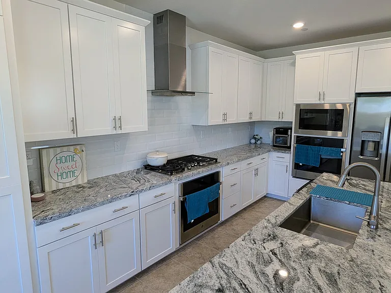 Chef's Dream Kitchen
A true chef's kitchen equipped with top-tier stainless steel appliances, luxury double oven, and expansive island. With generous counter space and smart design, culinary preparation becomes both effortless and enjoyable.