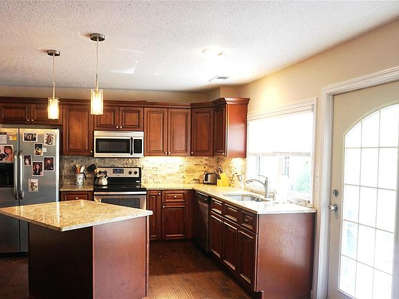 The kitchen has been remodeled with new cabinets & granite counters.