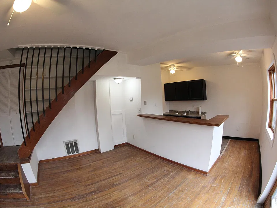 This is the view when you first enter the apartment. A newly remodeled kitchen sits to your right and the rest of the room is a spacious, open living area which can be a dining room or a living room and with a smaller dining area.