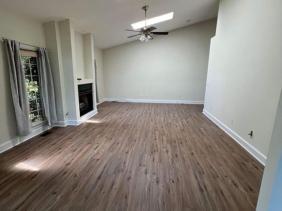Living room with views of backyard
