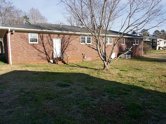 3 BR / 2 BATH - ALL BRICK RANCH HOME ON 1 ACRE LOT WITH 2 CAR ATTACHED GARAGE/ 1 CAR DETACHED GARAGE / DETACHED WORKSHOP AND/ OR STORAGE BUILDING / CENTRAL HEAT AND AIR / ~1450 SQ FT