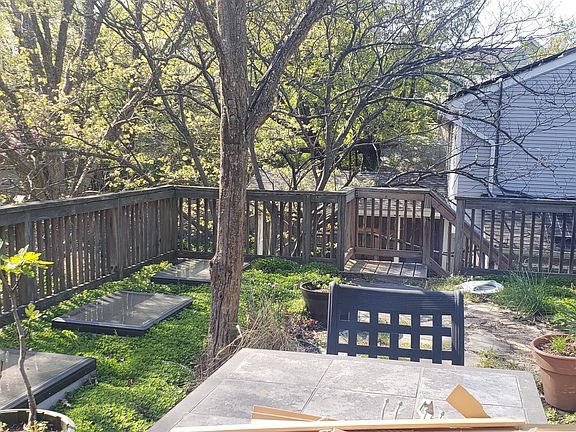 Outside patio with table that is for tenants looking towards steps.