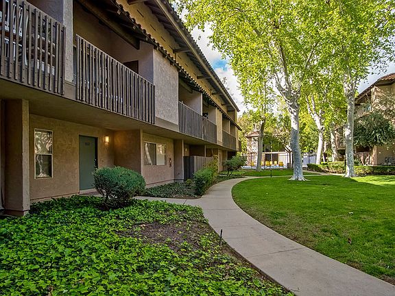 A variety of trees on the grounds offer a friendly welcome.