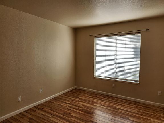 !st bedroom - pergo floors and well -lit room