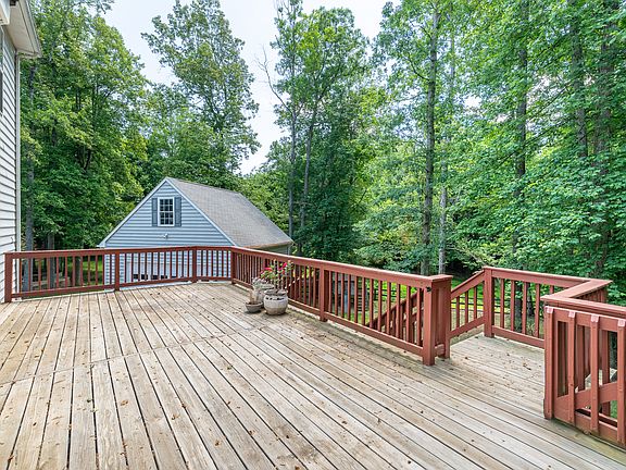 Large deck was recently refinished and offers a great view of the large. private backyard
