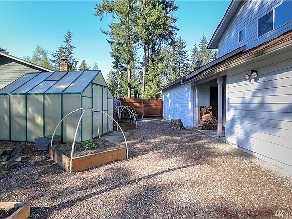 Off to the right near the woodpile is the utility room perfect for canning or your brew hobby!