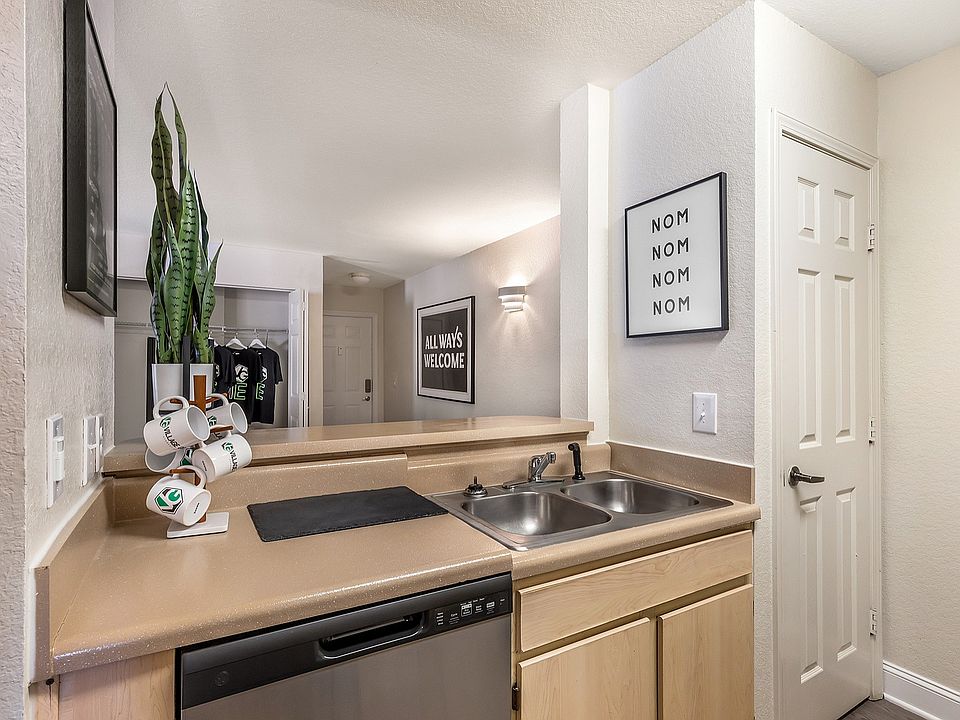 Explore the charm of this chic apartment kitchen, where style meets functionality.