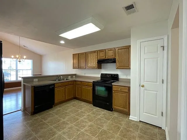 Fully equipped kitchen with a pantry closet.