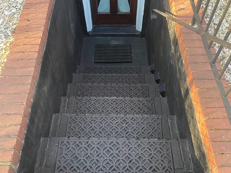 Steps to lower level private entrance