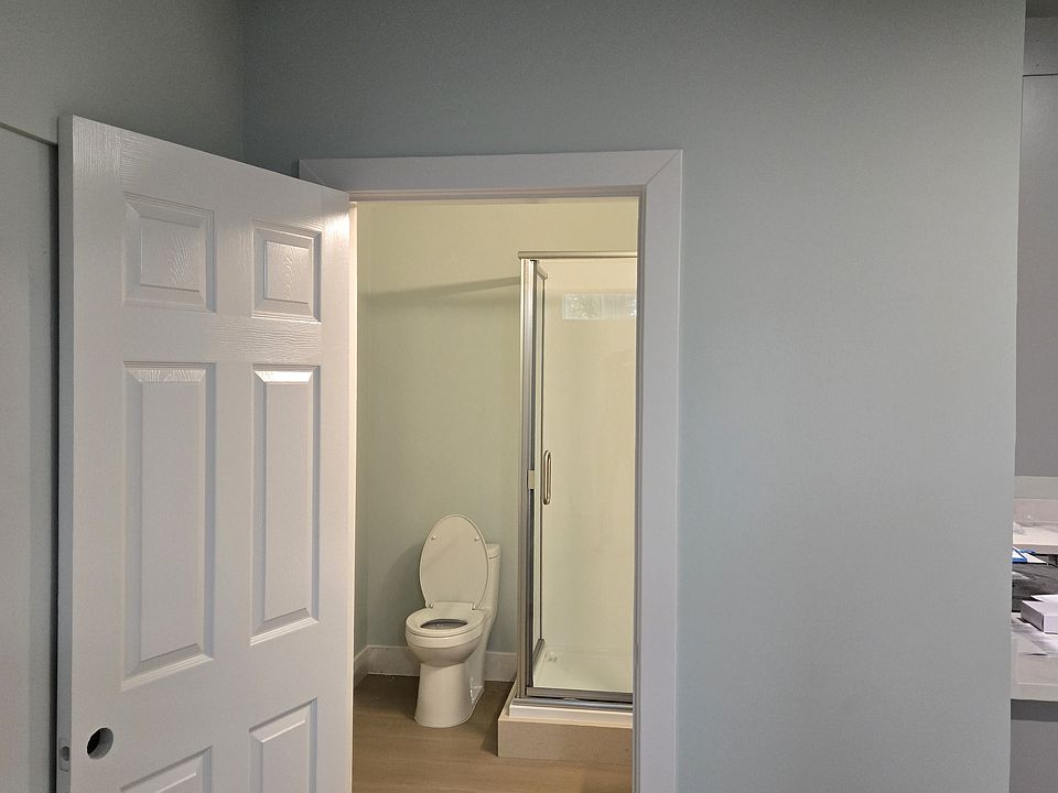 bath with 4' x 3' shower. Washer dryer hookups inside left of door.
