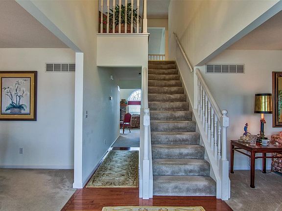 2 Story Entry with wood flooring . . .