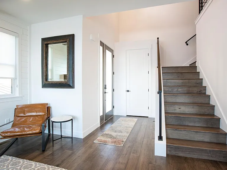 Front Door Entryway, stairs leading to upper floor where there is 3 bedrooms, bathrooms, loft, closet space and laundry room