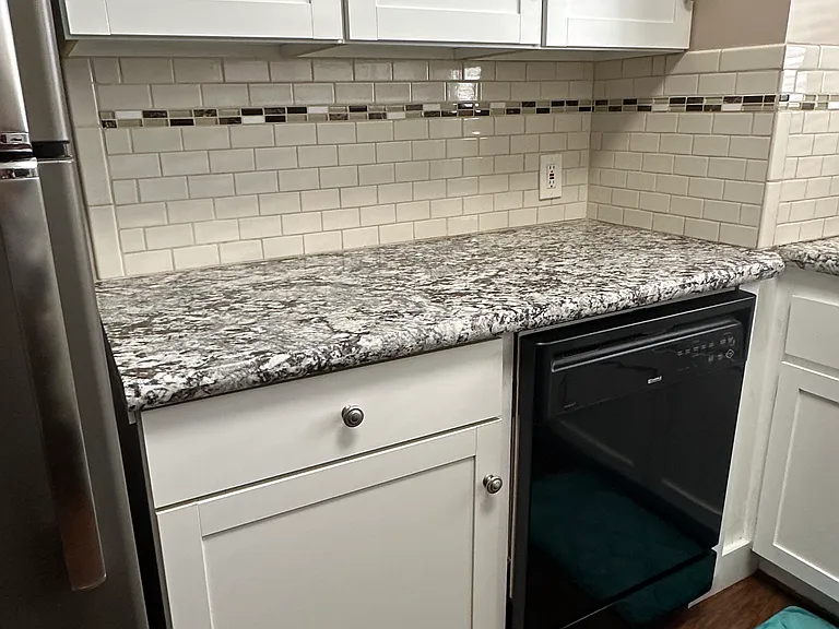 Take a good look at that fantastic tile backsplash and granite countertops.