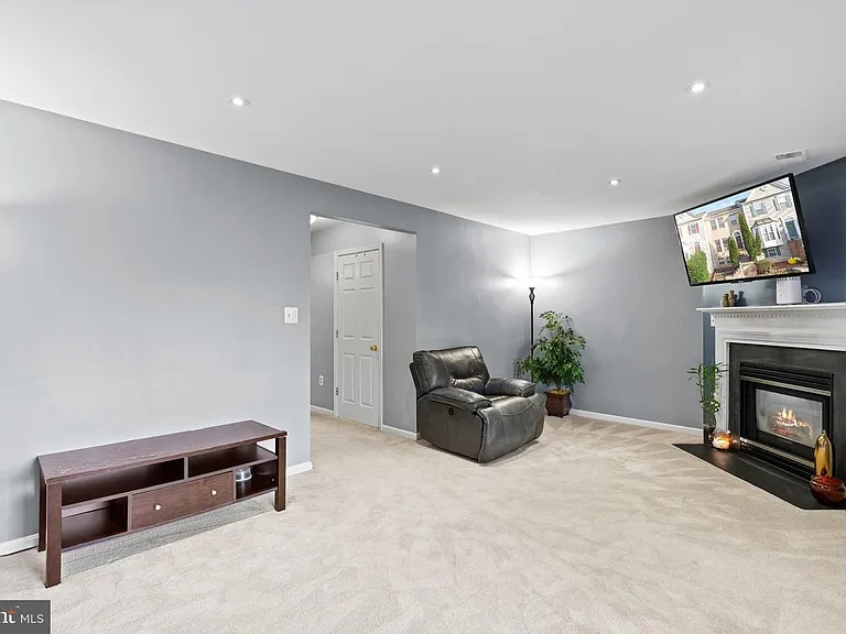 Family room with a fireplace - lower level