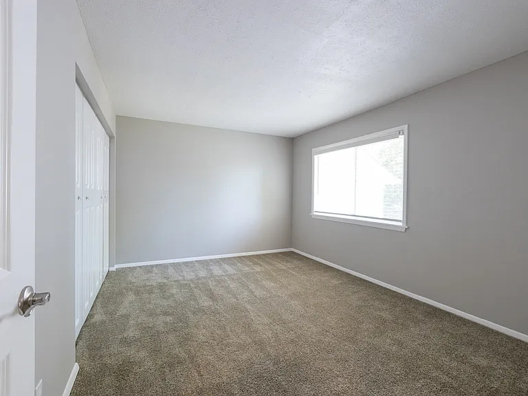 Primary Bedroom in the Three Bedroom Townhome at Woodbridge Bloomington
