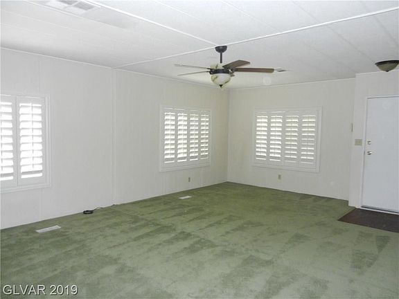 LIVING ROOM WITH MORE SHUTTERS