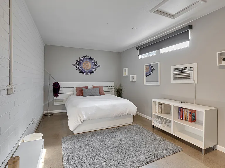 Guest bedroom with Queen bed and clean, modern finishes