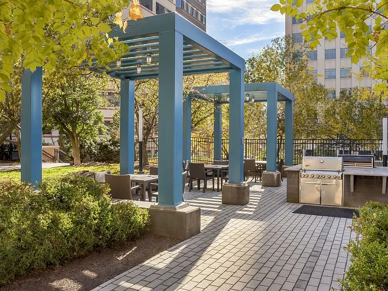 Courtyard with barbecue grills and dining area